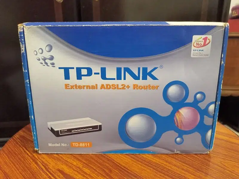 LCD, TP-Link router and Dish network receiver